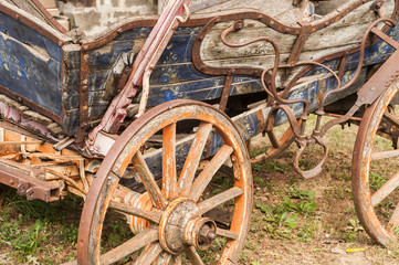 Old vintage retro weathered wooden rural carriage closeup