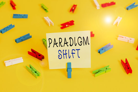 Writing note showing Paradigm Shift. Business concept for fundamental change in approach or underlying assumptions Colored clothespin papers empty reminder yellow floor background office