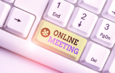 Conceptual hand writing showing Online Meeting. Concept meaning a meeting that takes place over an...