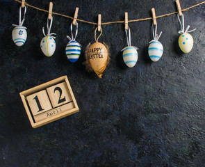 Easter holiday card concept with eggs on blue background with copy space