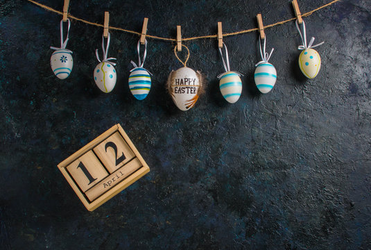 Easter holiday card concept with eggs on blue background with copy space - Powered by Adobe