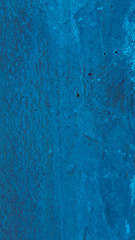 Vertical blue painted wall background. Painted wall texture with copy-space for writing