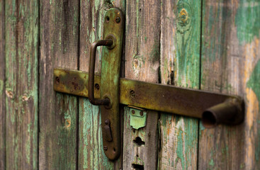 Old Wooden Door With Handle. An Old Wooden Door With Cracked Paint. Background. Handle With Keyhole. The Old Iron