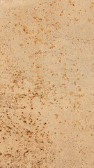 Rusty metal wall, old sheet of iron covered with rust with paint vertical background texture