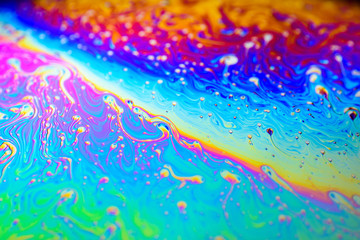 Fototapeta na wymiar Macro photo of a rainbow soap bubble