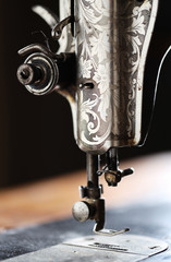 Closeup old sewing mashine on table