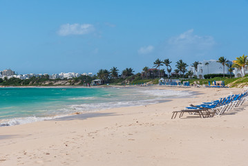 Fototapeta na wymiar Sunbeds on a caribbean beach