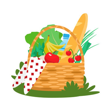 Picnic basket with fruits and vegetables, water, beguette and cloth.