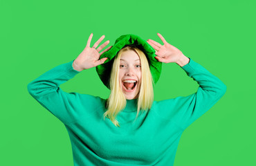 Traditions of Saint Patrick Day. Happy girl in green hat celebrate Patricks Day. Leprechaun....