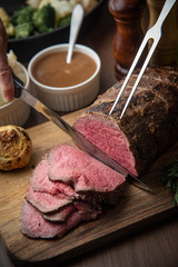 sliceing roasted eye of round beef with knife