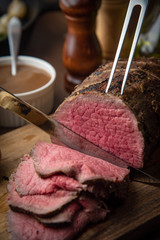 sliceing roasted eye of round beef with knife