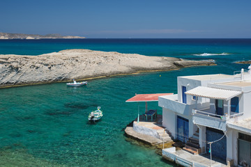 Fototapeta na wymiar Crystal clear blue water at Mitakas village beach, Milos island, Greece.