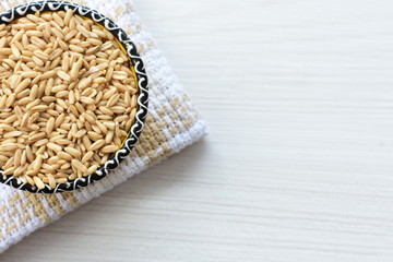 Natural oat grains, in containers for display