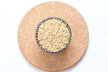 Natural oat grains, in containers for display