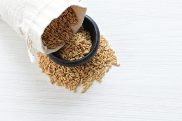 Natural oat grains, in containers for display