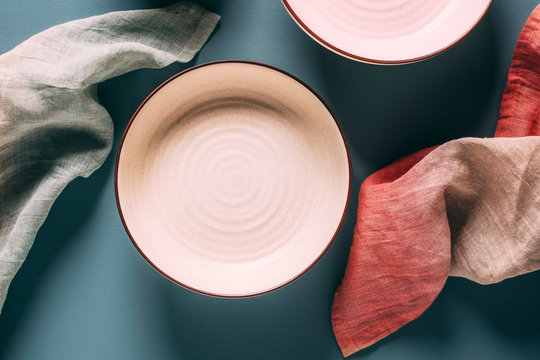 Still life of pastel colored ceramic dishes with ombre linens