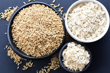 Oat grains and flakes, in containers for display