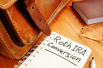 Roth ira conversion memo near retro briefcase and glasses. - obrazy, fototapety, plakaty