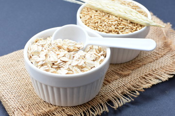 Oat grains and flakes, in containers for display