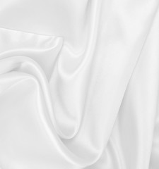 Obraz premium Smooth elegant white silk or satin luxury cloth texture as wedding background. Luxurious background design