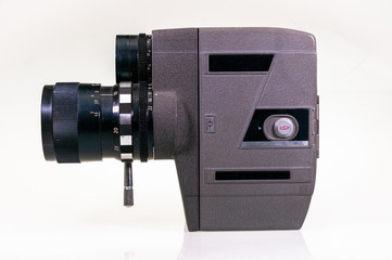 Vintage 8mm cine-camera on white background