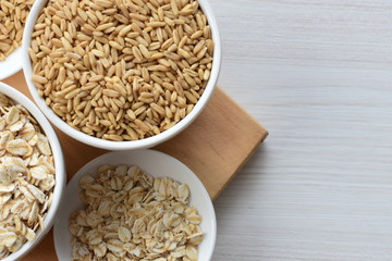 Oat grains and flakes in containers for display
