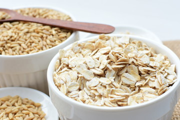 Oat grains and flakes in containers for display