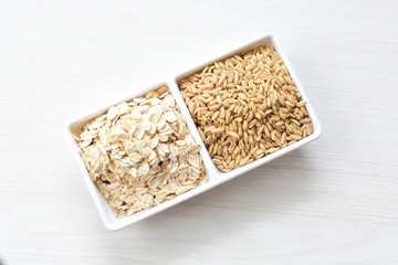 Oat grains and flakes in containers for display