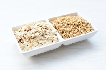 Oat grains and flakes in containers for display