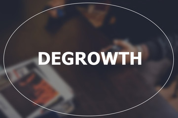 Degrowth word with blurring business background