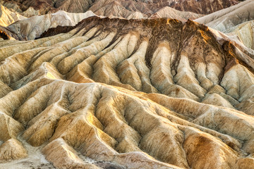 Badlands view from Zabriskie Point in Death Valley National Park at Sunset