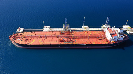 Aerial drone photo of huge fuel tanker ship docked in industrial area of Elefsina, Attica, Greece