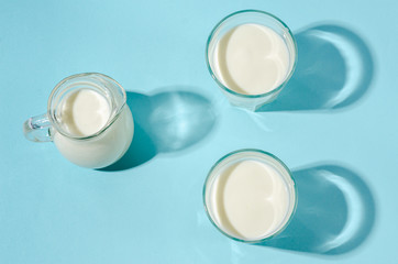 Homemade fermented drink - kefir on a blue background, copy space.
