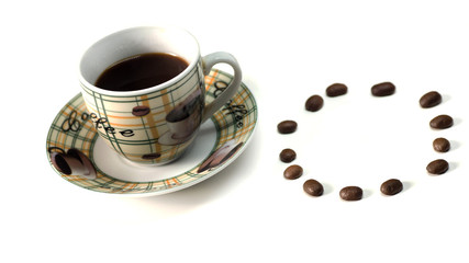 A Cup of hot coffee with scattered grains on a white table