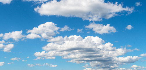 Fototapeta premium Group of white clouds between a blue sky in the south of Chile