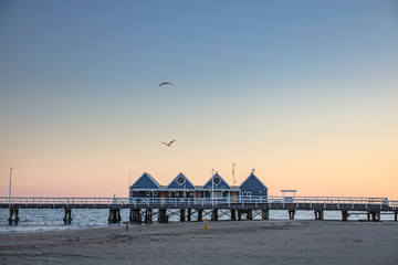 View of the 4 iconic huts at the start of Busselton Jetty, captured at dawn; Busselton is a popular tourist destination in Western Australia