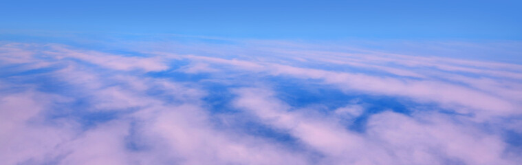 Light pink clouds above the ground top view.