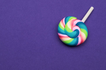 Colorful candy close up. lollipop isolated on color background. copy space