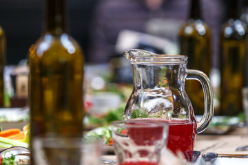 A jug of fruit juice on the table