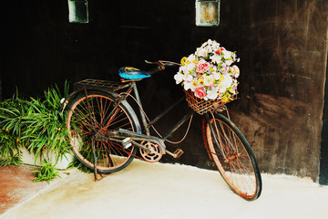 Vintage bicycle with a bouquet of flowers
