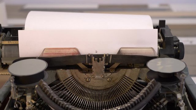 close-up typing a text DEAR MR PRESIDENT PUTIN, old vintage typewriter with a sheet of paper 