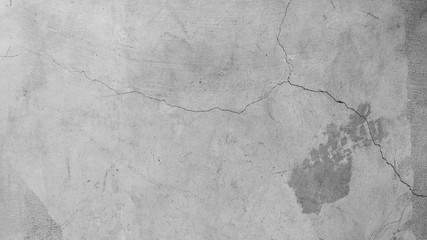 Naklejka premium Abstract textured cement concrete gray background and wallpaper. Cracks are rugged, vintage is suitable for doing folk. 