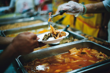 The hands of the poor request food donations donated by philanthropists.