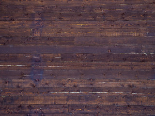 Naklejka premium Texture of a wooden wall from old crimson boards. Siberian larch