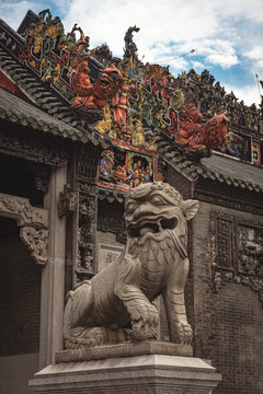 Fu dog at the entrance of Chen Clan Ancestral Hall. Chinese temple, great tourist museum. Asian travel and destination. Art in the roof. Antique building.
