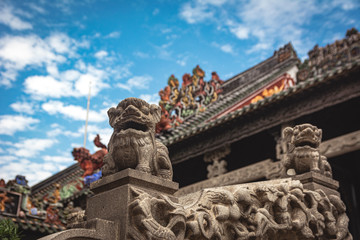 Fu dogs in ancient temple. Chinese culture, art in the roof. Asian architecture. Exotic Tavel and Destination. 