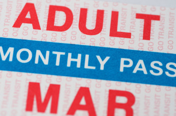 Red and blue monthly pass for adult commuter train ticket