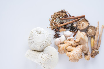 Spice herbs and compress ball on white background and copy space. Food and cuisine ingredients.Healthy herbal gourmet in the kitchen.