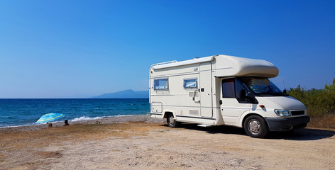Obraz na płótnie Canvas caravan car by the sea in summer holidays