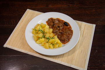 Liver with onion sauce and Pork chop with nature potatoes